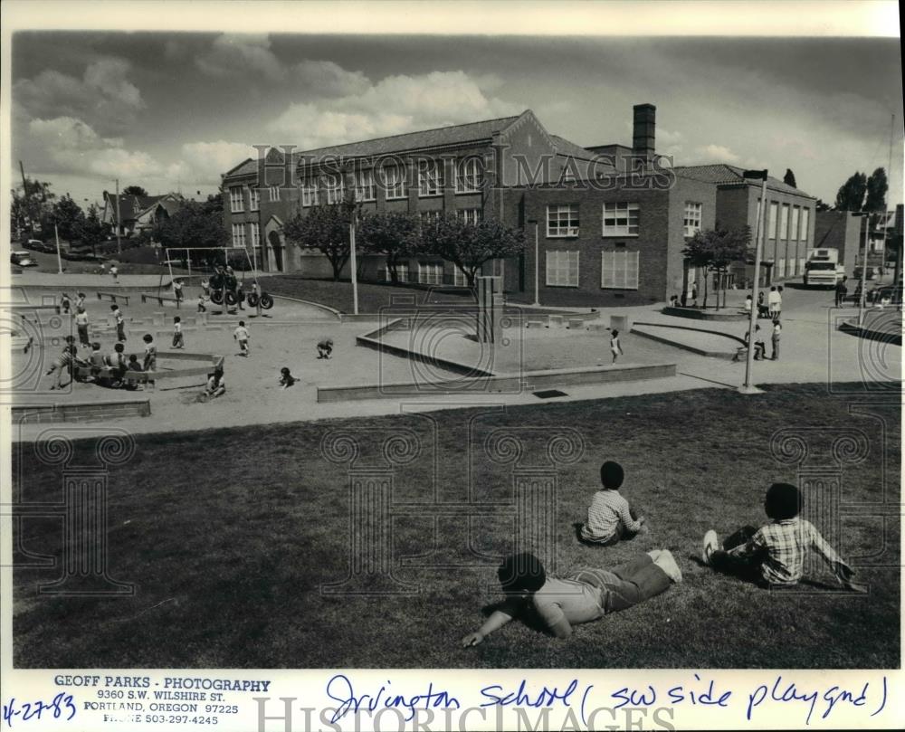 1983 Press Photo Youngster rest on the playground of Brick Irvington School - Historic Images