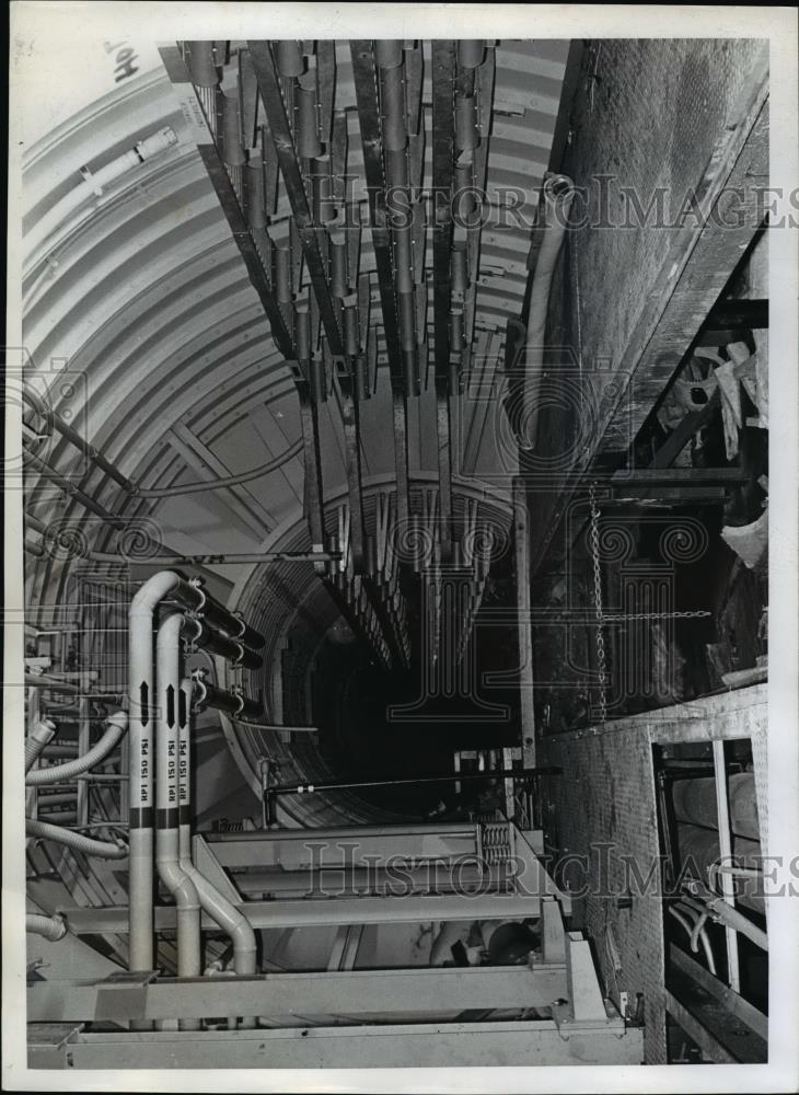 1969 Press Photo Underground Storage Inc. Wires in racks fill tunnels under fuel - Historic Images