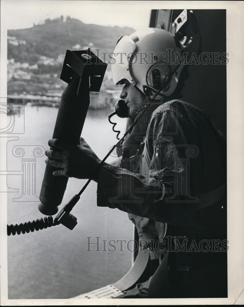 1964 Press Photo Coast Guard Rescue -A Topedo smoke signal is readied for toss - Historic Images