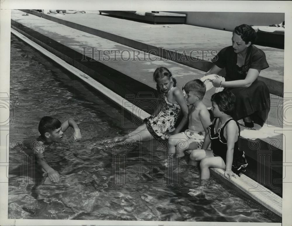 1952 Press Photo Ms Fred Seaton Shown With Newly Adopted Family at Swimming Pool - Historic Images