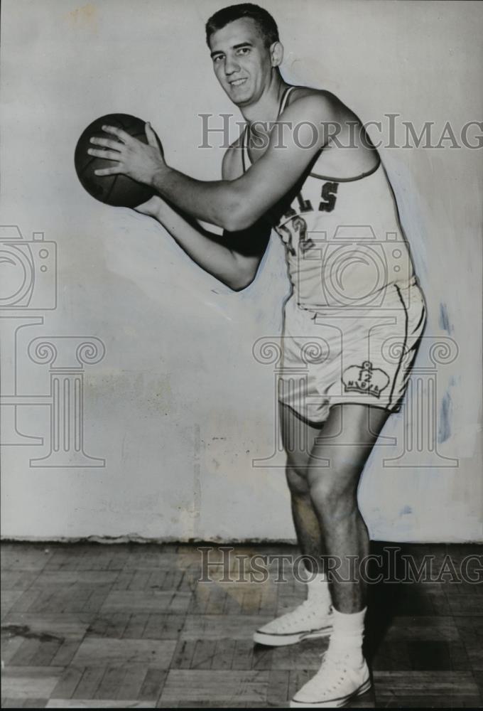 1959 Press Photo Dave Piontek, one time Xavier great holding the ball. - Historic Images