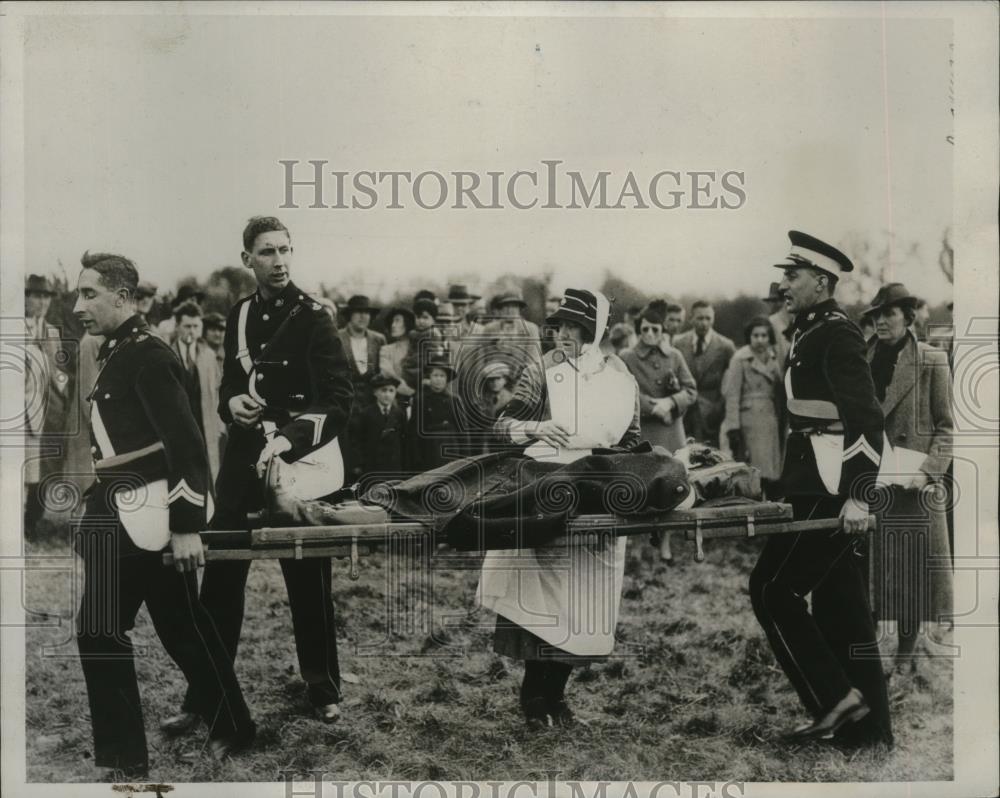 1938 Press Photo Nurse Watches Over Miss Jo Orpwood As She Carried Off The Field - Historic Images