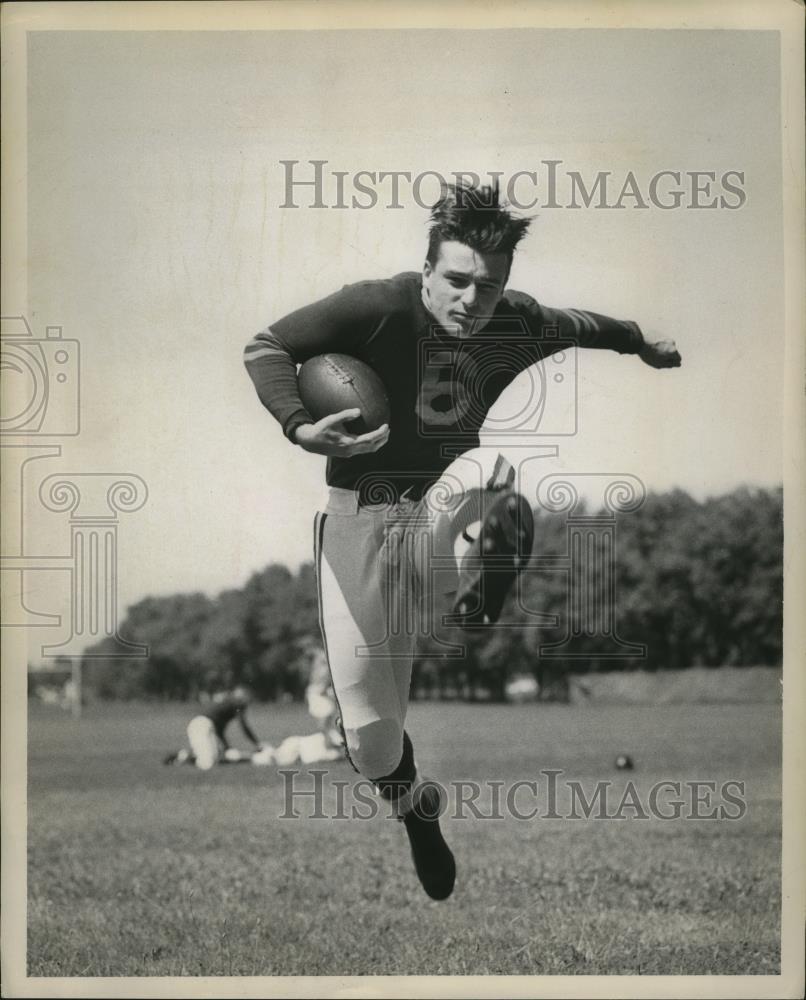 1947 Press Photo A football player in action on a practice field - net30829 - Historic Images