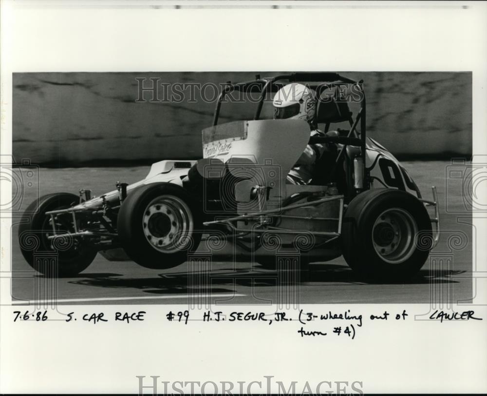 1986 Press Photo Car Race - H.J. Segur, Jr. - orc09479 - Historic Images