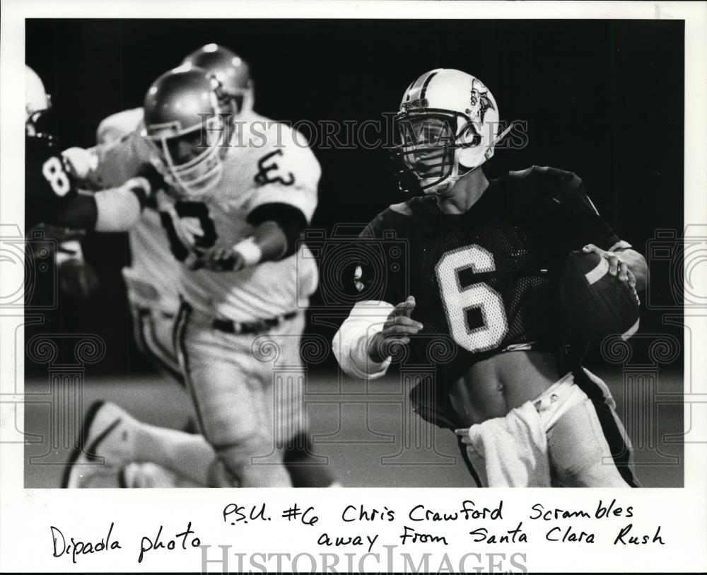 Press Photo Chris Crawford scrambles away from Santa Clara Rush during the game - Historic Images