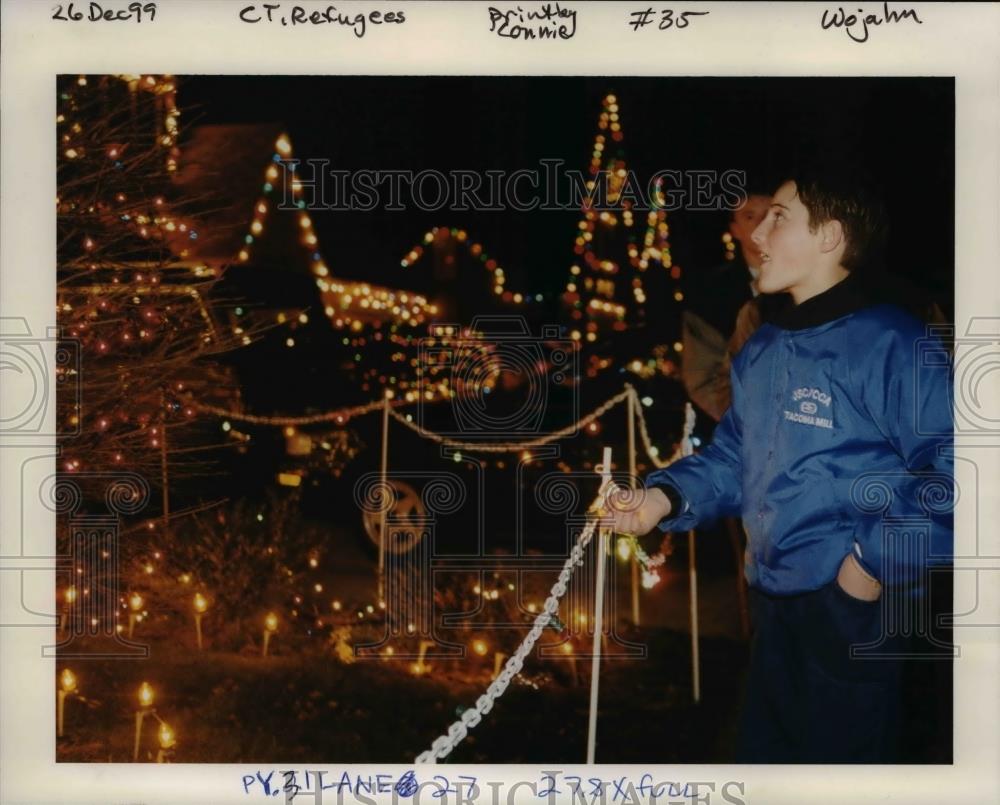 1999 Press Photo Boy looks at Christmas lights - orb05426 - Historic Images