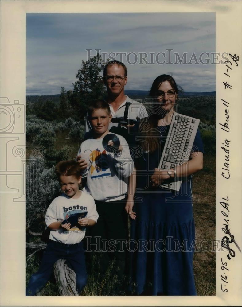 1995 Press Photo Family Holding Computer Items in Oregon - orb08063 - Historic Images