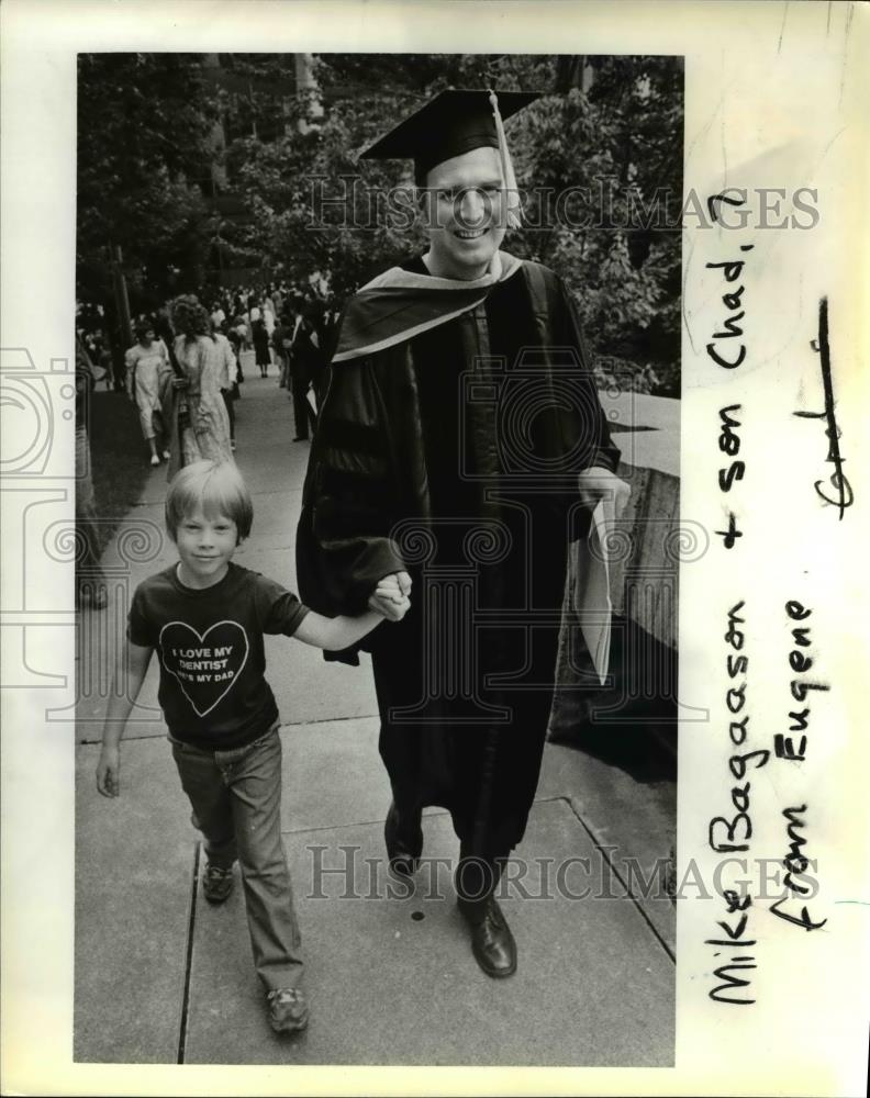 1980 Press Photo Chad Bagaasan Walks Proudly with his Father, who was Graduated - Historic Images