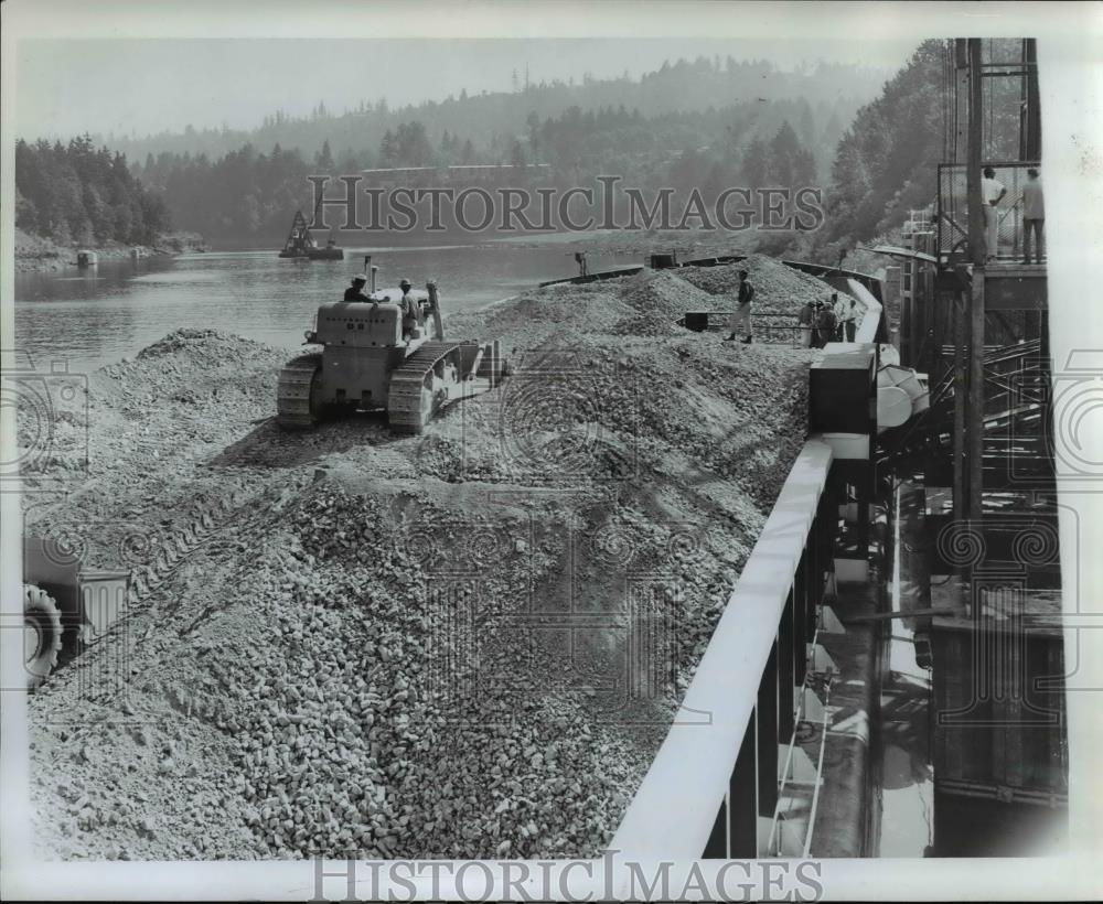 Press Photo Bulldozer Unloads Canadian Limerock at Portland Cement Co. - Historic Images