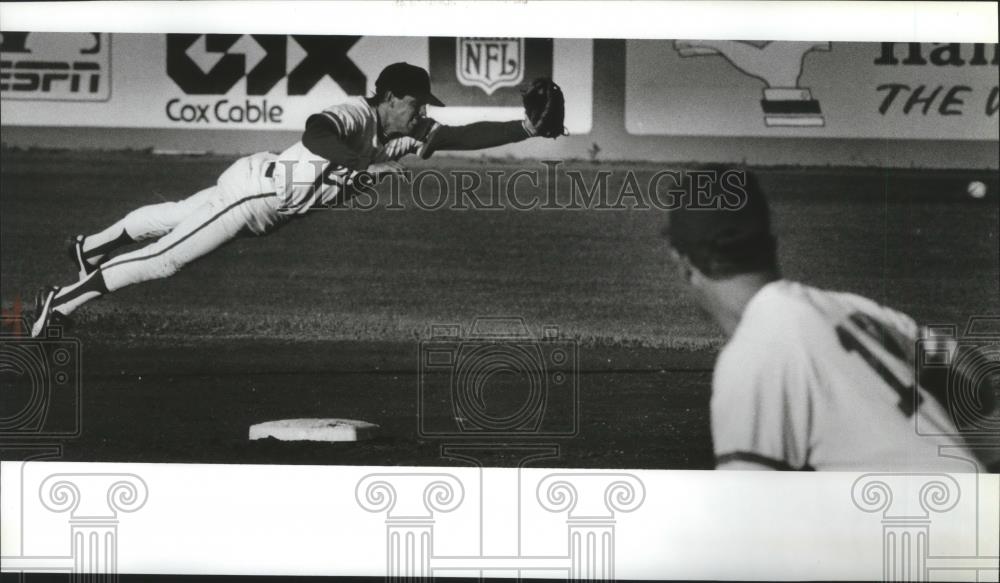 1991 Press Photo Scott Bream-Spokane Shortstop Dives in Vain for Baseball - Historic Images
