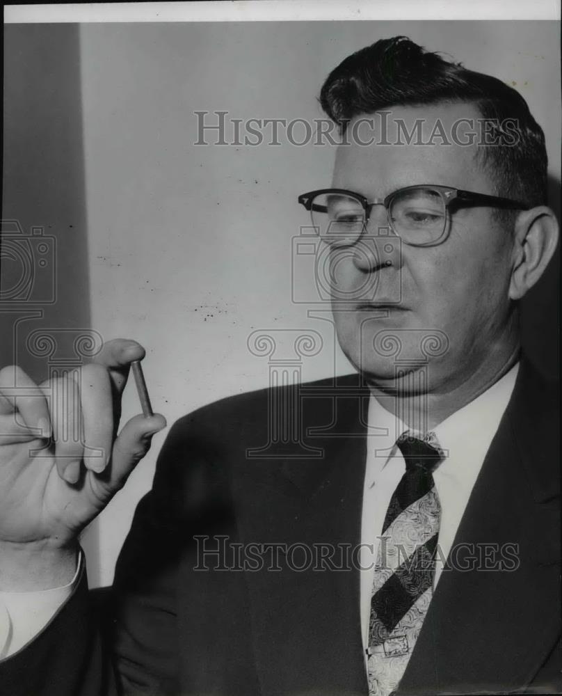 Press Photo William Reilly a Sheriff examines piece of dynamite in his hand - Historic Images