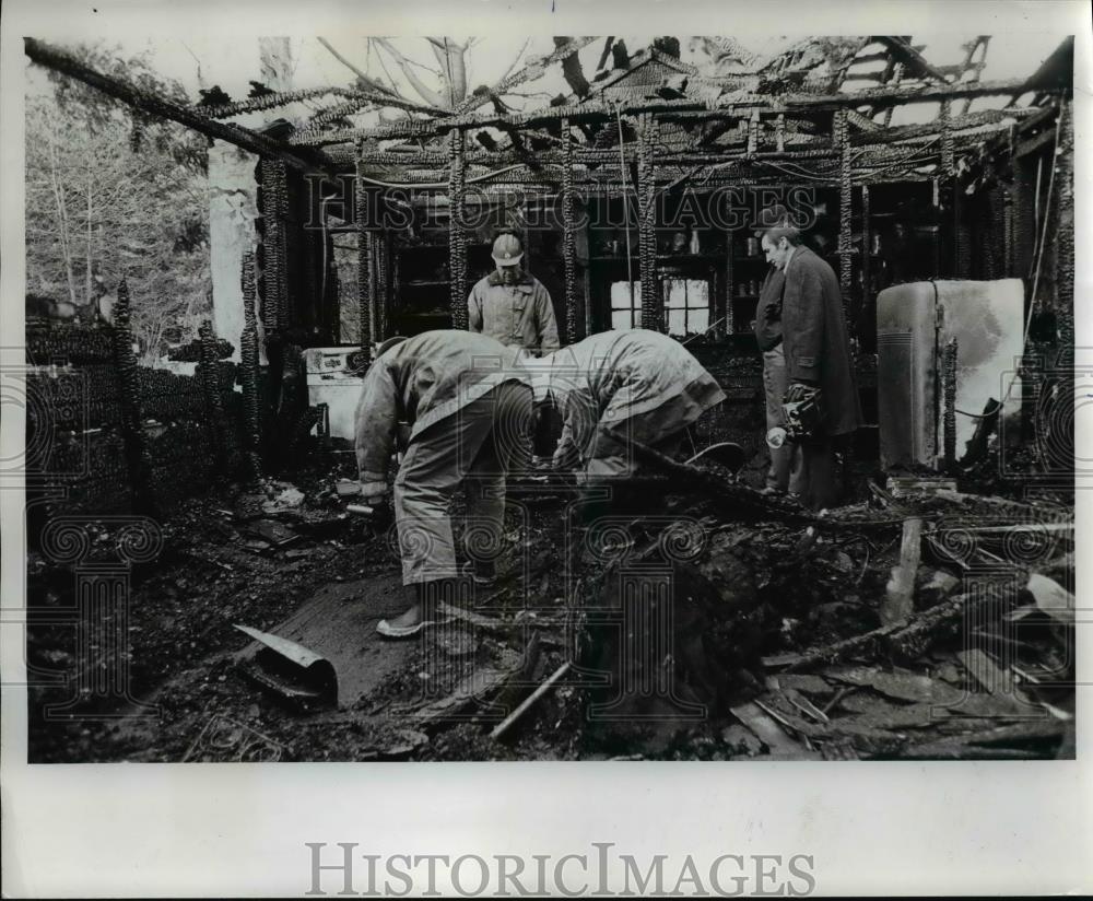 1973 Press Photo Firemen probe charred floor of Northeast Portland home - Historic Images