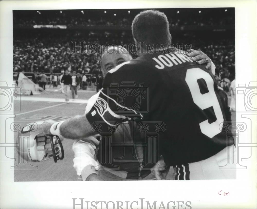 1991 Press Photo Seattle Seahawks owner, Ken Behring, hugs player - sps03163 - Historic Images