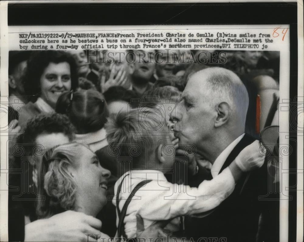 1959 Press Photo French President Charles de Gaulle kisses 4 year old Charles - Historic Images