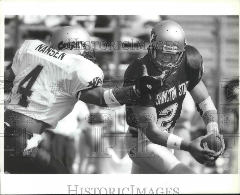 1994 Press Photo Football players, Johnny Nansen &amp; Chad DeGrenier during game - Historic Images