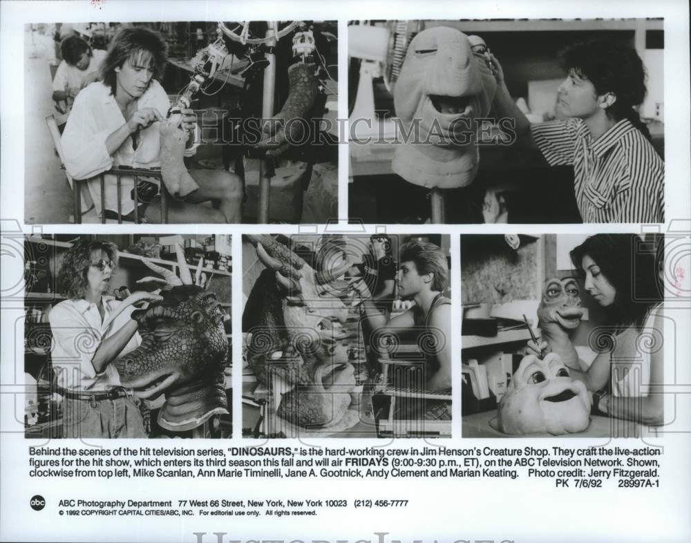 1992 Press Photo Behind the scenes crews work on Dinosaurs characters. - Historic Images