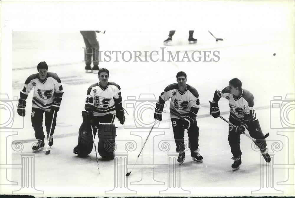 1987 Press Photo Spokane Chiefs hockey players stand tall on the ice rink - Historic Images