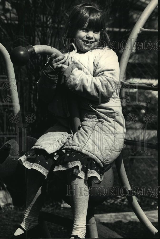 1988 Press Photo Sarah Kaveny Plays on Playground Equipment  - mja65794 - Historic Images