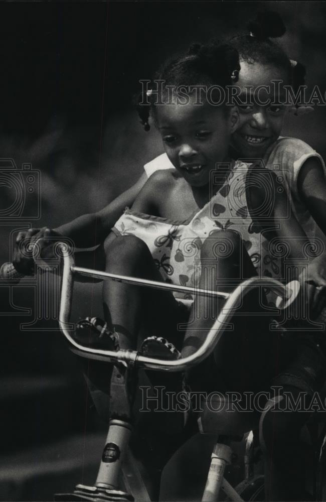 1988 Press Photo Shaquita Glover and Latoya Simmons Ride a Bicycle - mja67840 - Historic Images