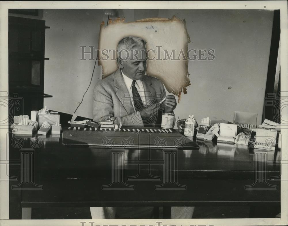 1929 Press Photo Department of Commerce Has Expert Studying Foreign Cigarettes - Historic Images