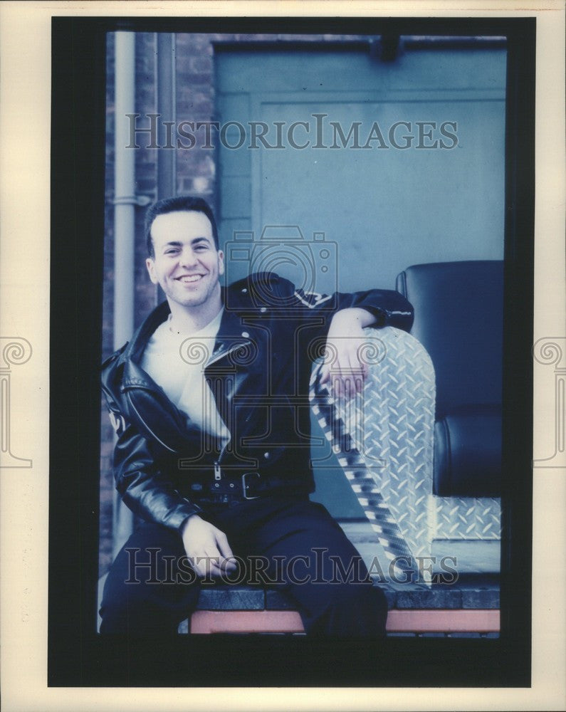 1990 Press Photo Man near steel couch - Historic Images