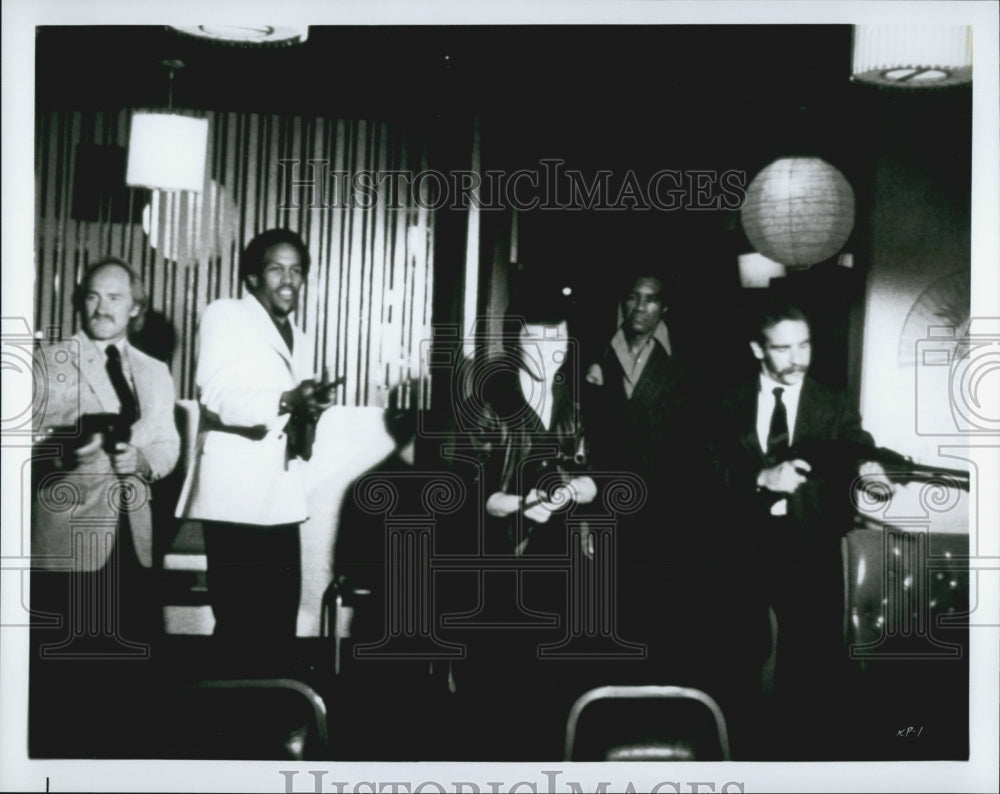 Press Photo Men With Guns In Scene From Movie - DFPG12051 - Historic Images