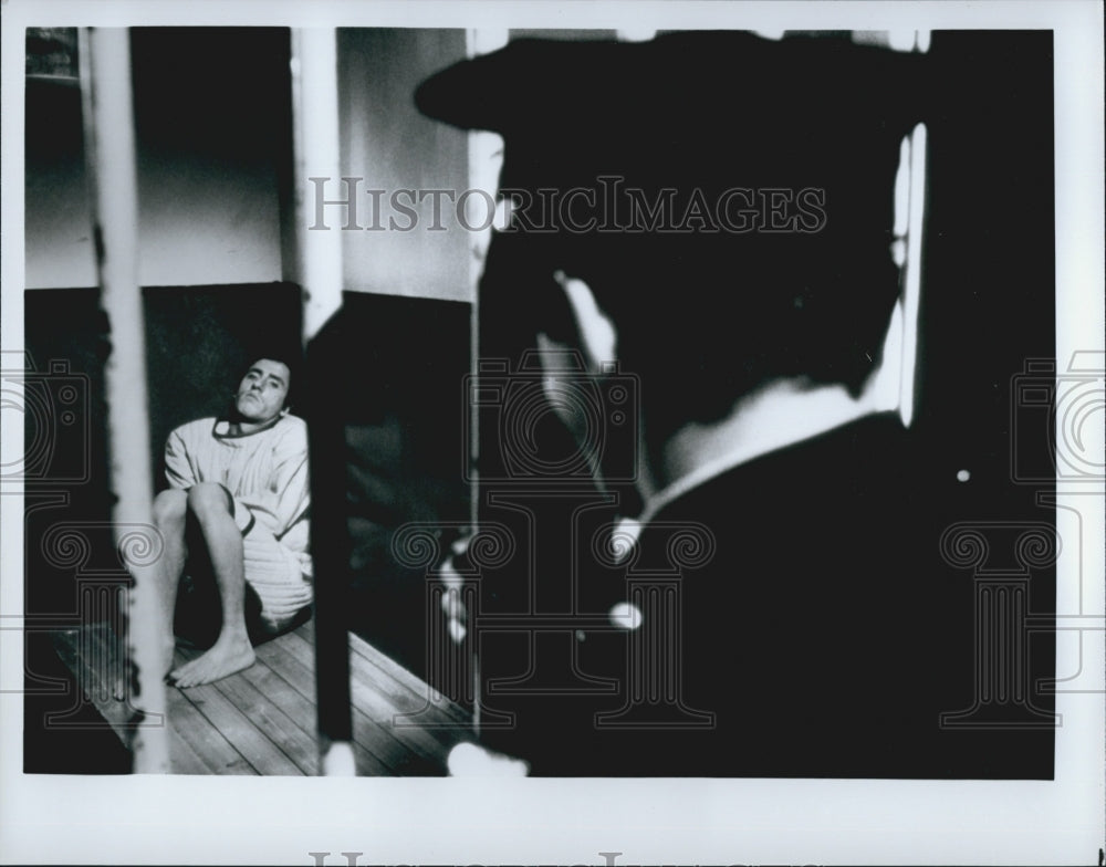 Press Photo Actor In Straightjacket In Prison With Policeman In Unknown Film - Historic Images