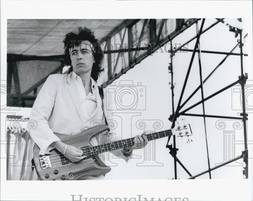 Press Photo Musician Plays Guitar During Band Concert Performance - Historic Images