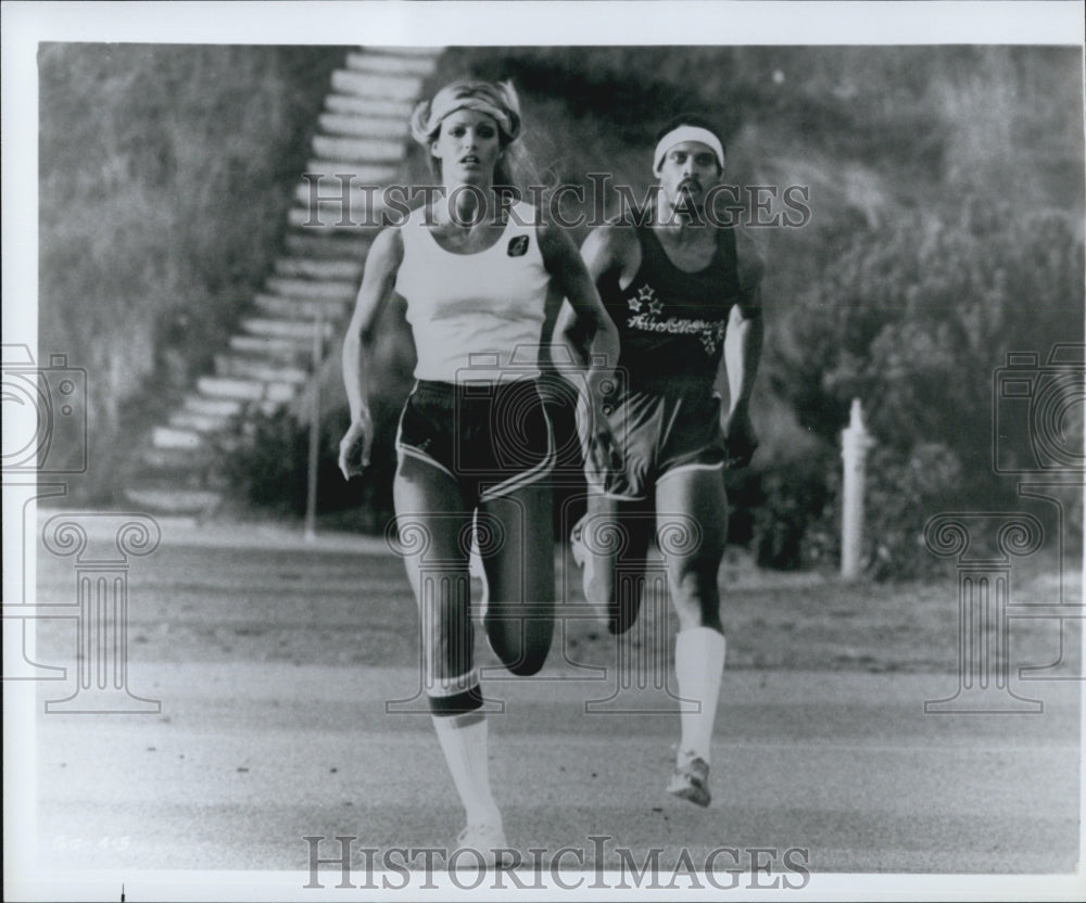 Press Photo Two actors in a movie out jogging - DFPG74023 - Historic Images