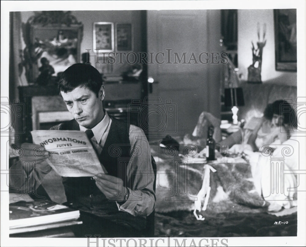 An actor & actress in a film scene in a bedroom - Historic Images