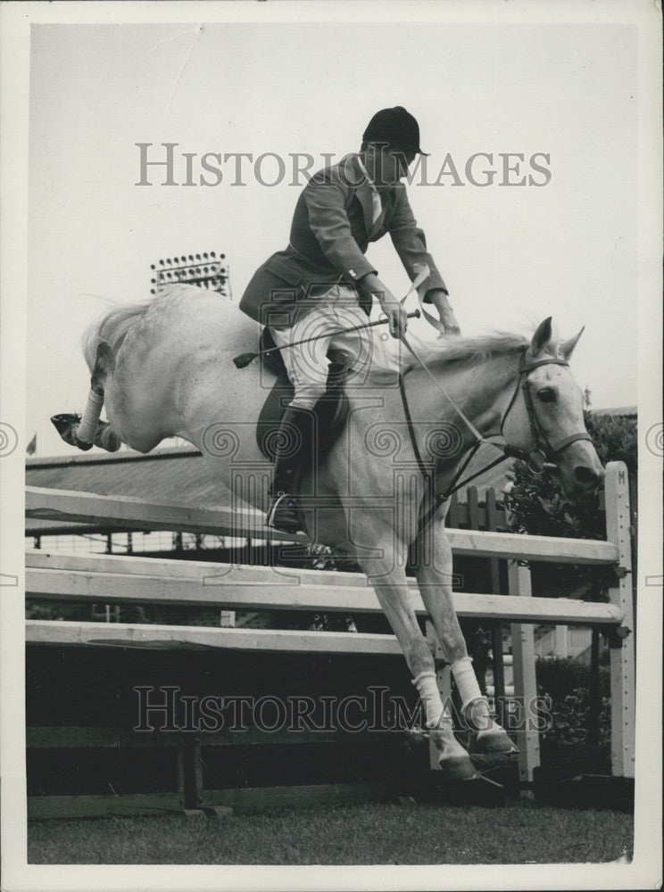 1955 Major G. Gibbon takes a jump on "Saida" - Historic Images