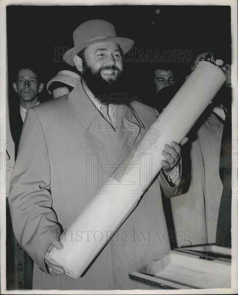 1956, Rev. G. Moslev Dean with stick of Mar gate Rock in London - Historic Images