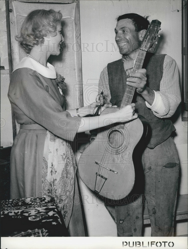 1953 Press Photo Potenze Villager PLays Guitar For Ambassador - KSB02783-Historic Images