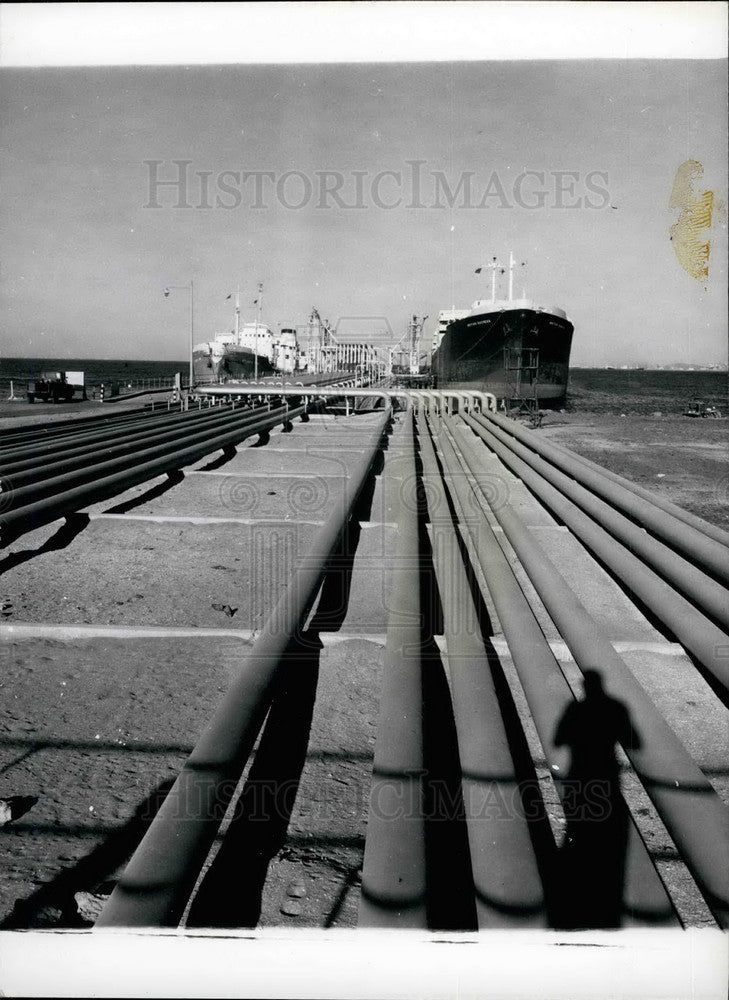  Oil storage tanks at dock to load ship - Historic Images