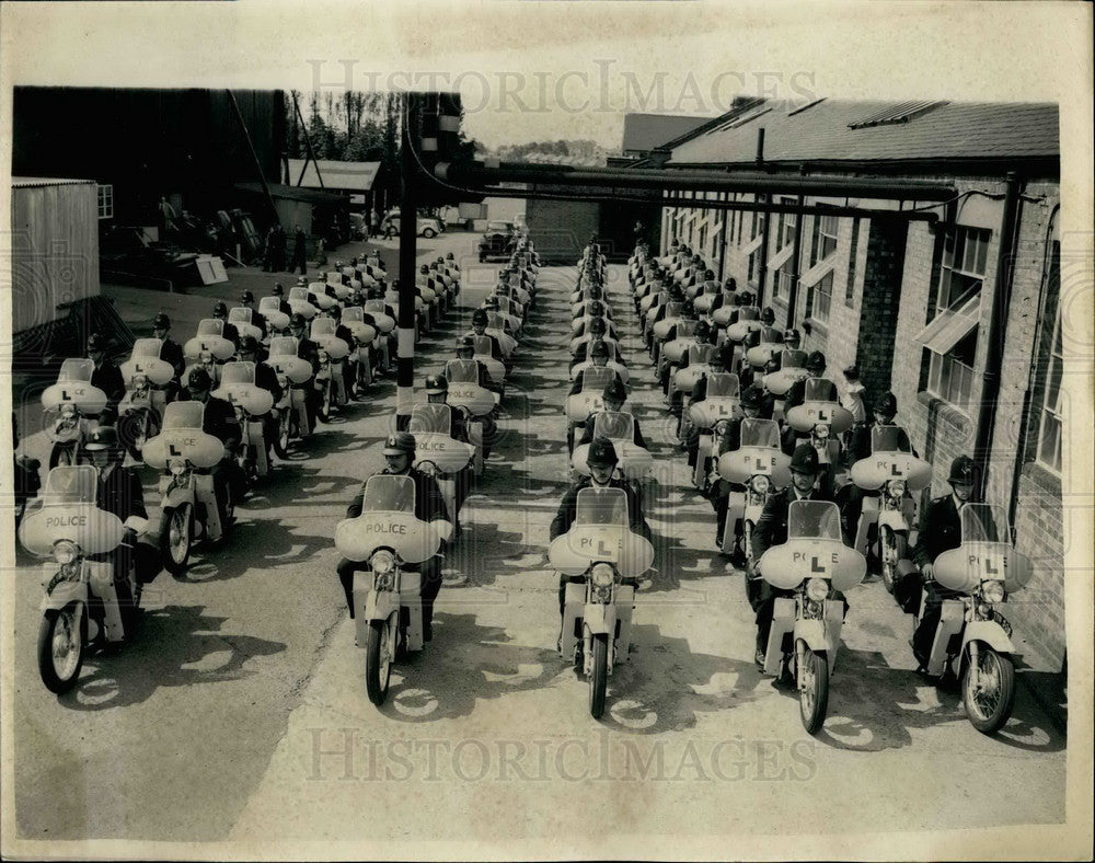 1957 policemen train on lightweight motorcycles. - Historic Images