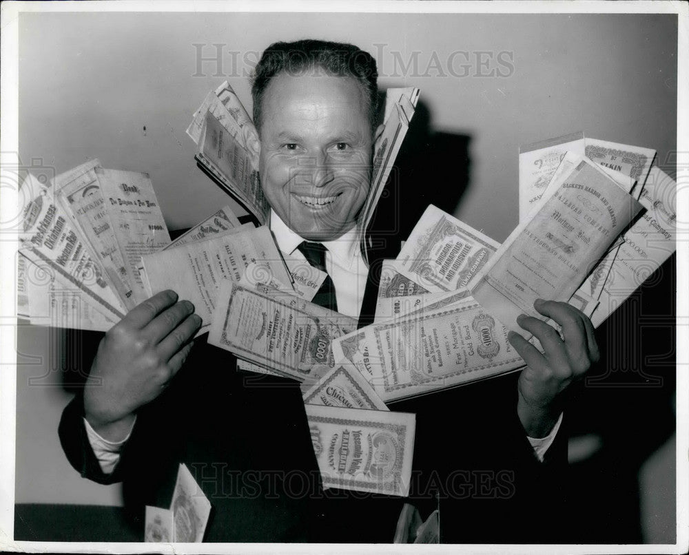 1964 Robert O. Greenwalt, an architect  collects defunct stocks - Historic Images