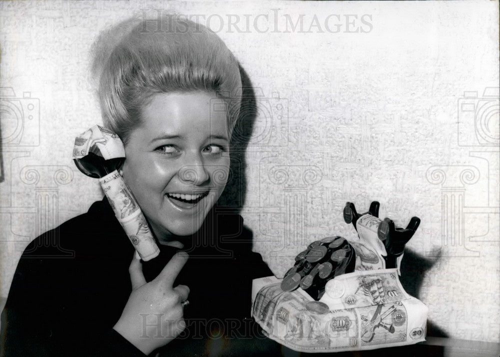 1964 Press Photo Telephone decorated with banknotes and coins - KSB19199 - Historic Images