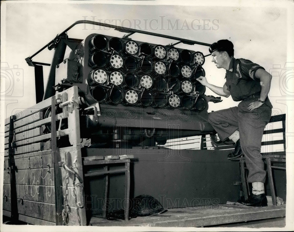 1956 Press Photo Sgt. Norman Smith from Blackburn With Captured Russian Rockets - Historic Images