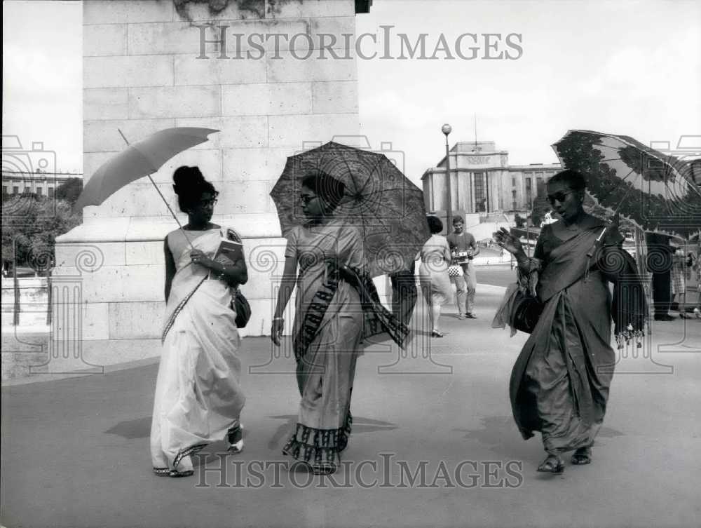 1966 Indian Tourists with Umbrellas in Paris  - Historic Images