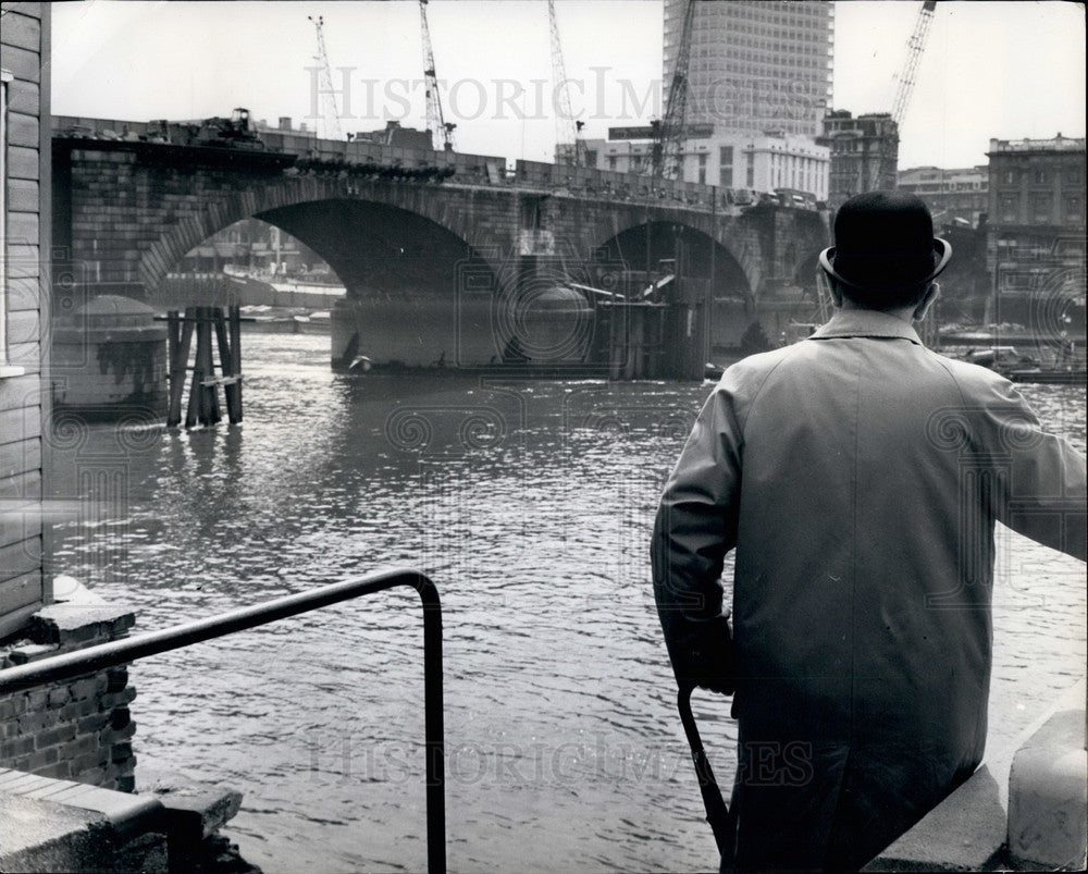 City Businessman Looks Over The Old Bridge  - Historic Images