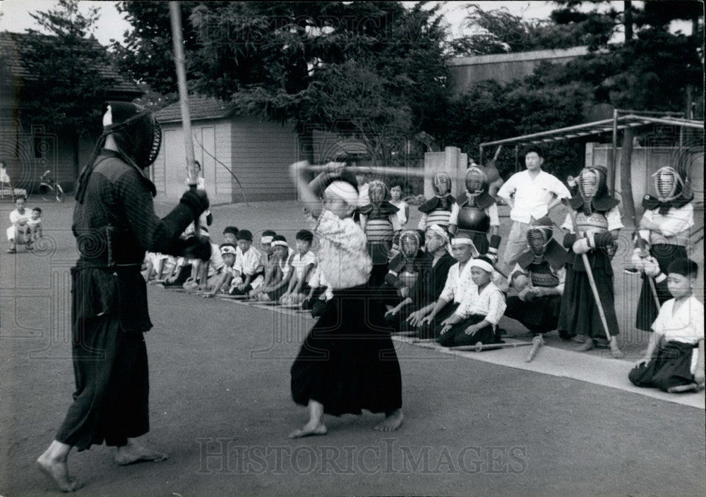 Sword play at martial art school  - Historic Images