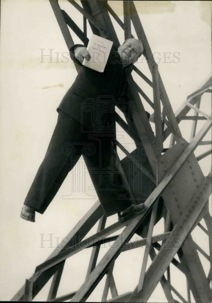  Paul Payot on a beam from the Eiffle Tower - Historic Images