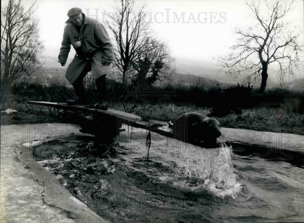 Press Photo Mr.Hurrell and pet on seesaw - KSB24923-Historic Images