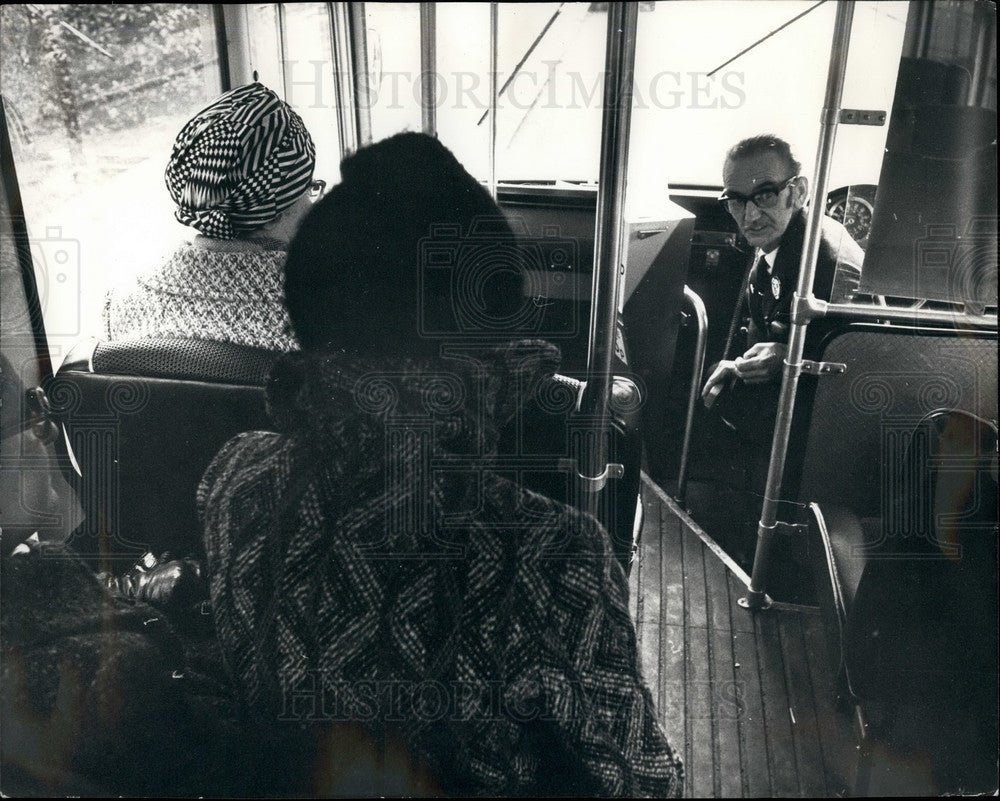 Press Photo Driver Checks Destination of Passengers - Historic Images