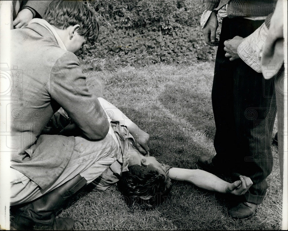 Press Photo Man Lies On Ground - KSB27603 - Historic Images