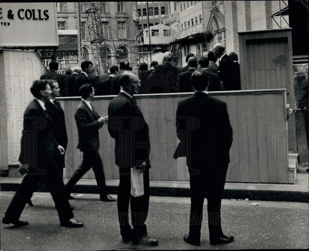 1967 People watch at a construction site - Historic Images