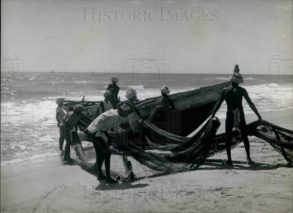  Fishermen Launch Their Boat - Historic Images