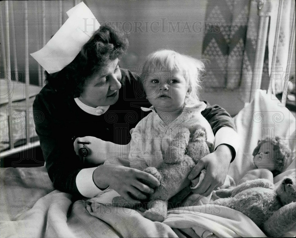 1962 Anne Herbertson,18 months old alive after falling under train - Historic Images