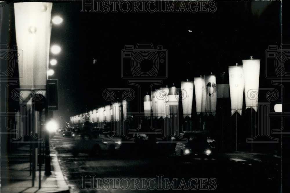 1968 Press Photo Street Lights Decorated with Flags for Grenoble Winter Olympics-Historic Images