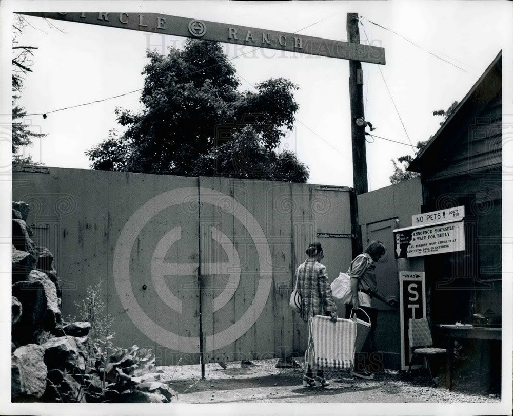 Press Photo People and a H sign - KSB32027 - Historic Images